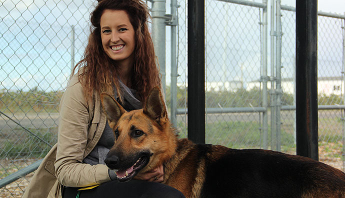 Dog shelter volunteer with dog