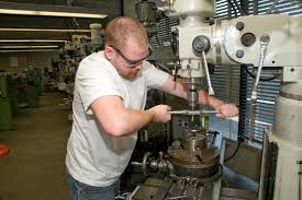 man using drill press