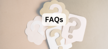 A group of paper cutout question marks layered together on a neutral background, with the text "FAQs" displayed.