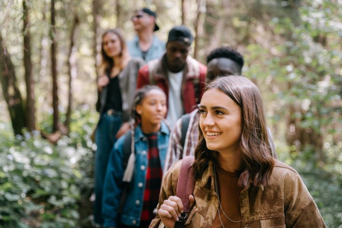 people hiking in the woods