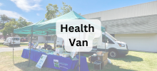 Outdoor setup with a tent and tables next to a van, with the text "Health Van" displayed.