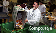 An employee sorting food scraps the support the composting program.
