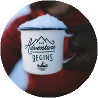 adventure begins here mug with snow on top