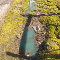 spill discollored water in ditch