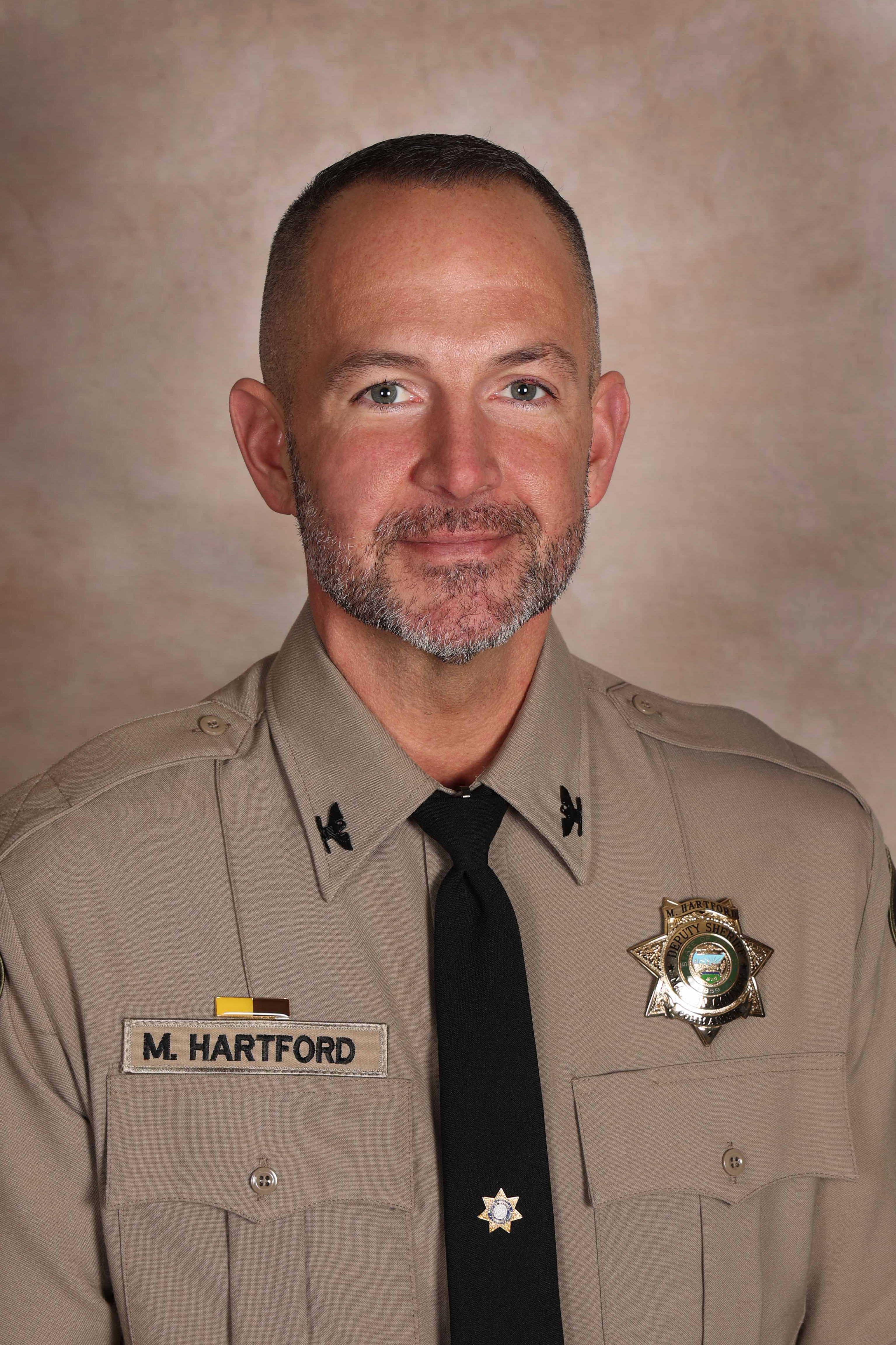 Headshot of Commander Hartford