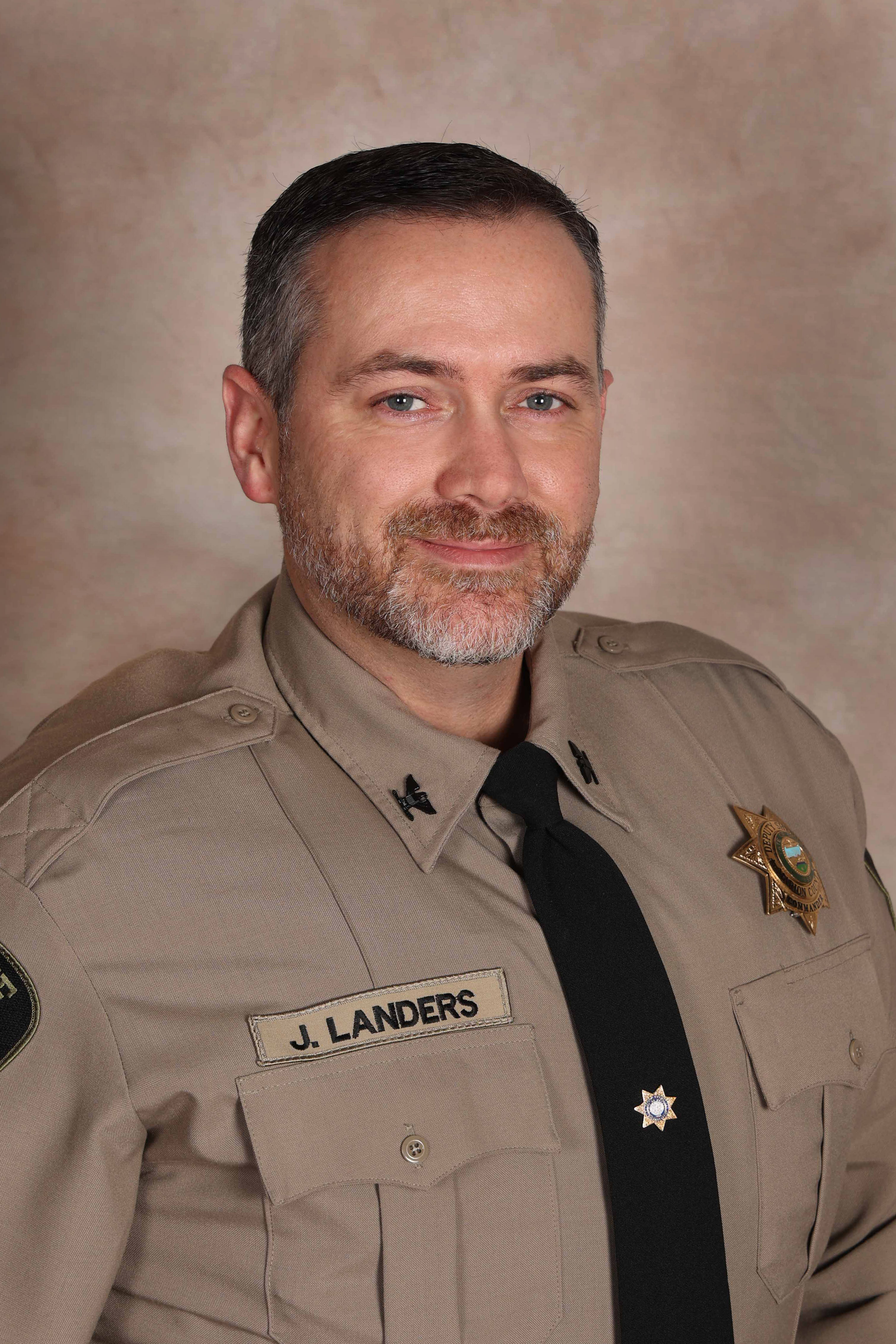 Headshot of Commander Landers